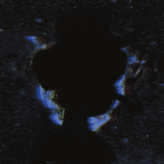 a shadow of a person wearing a top hat is against a blue background