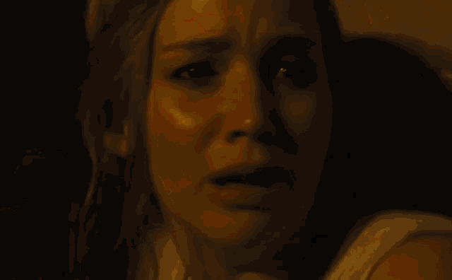 a close up of a woman with her mouth open