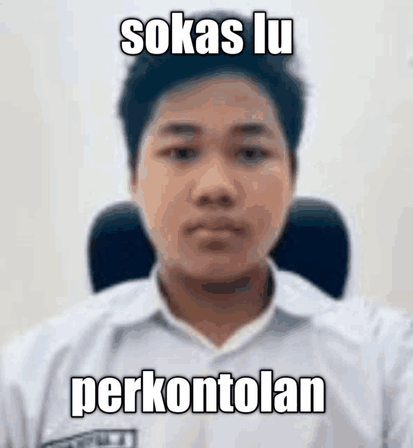 a young man is sitting in a chair with a meme written on his face .