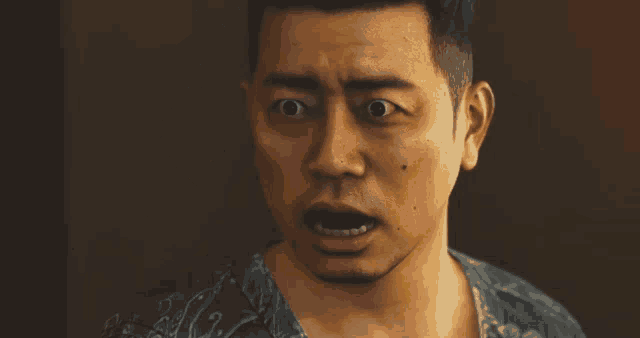 a man is making a surprised face with his mouth open