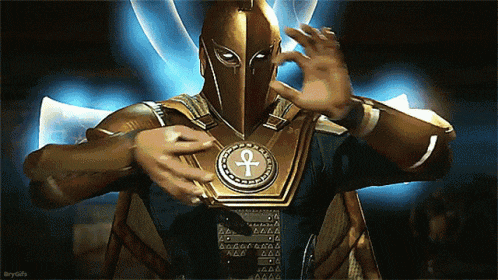 a man in a superhero costume with an ankh on his chest