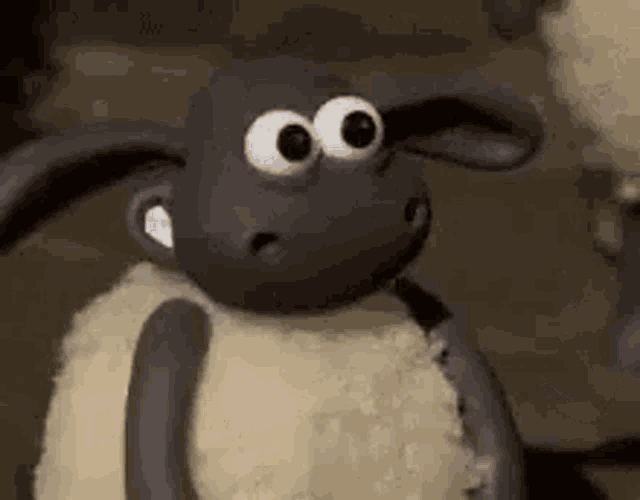 a close up of a stuffed animal with big eyes .