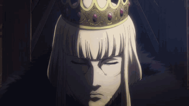 a man with a crown on his head looks down