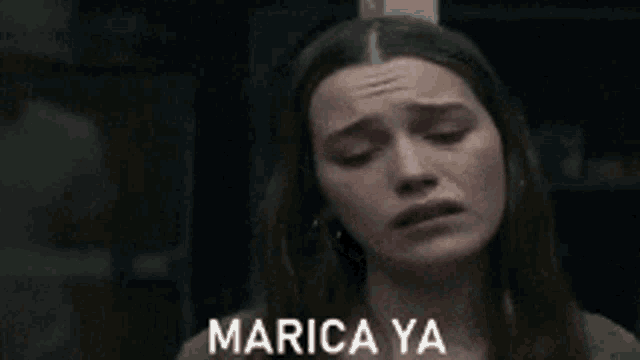 a woman is crying with the words marica ya written on the bottom