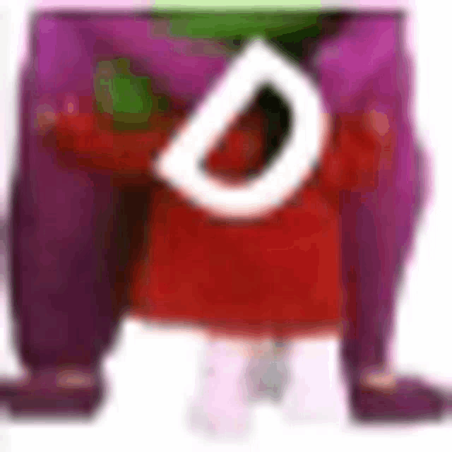 a cartoon character with purple pants and a red shirt is standing on a white surface .