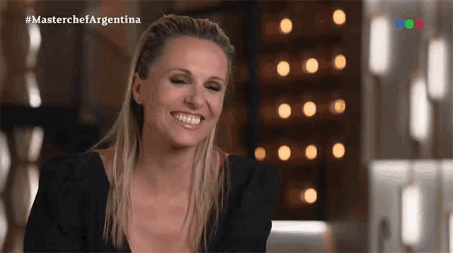 a woman is smiling in a masterchef argentina video