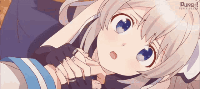 a girl with white hair and blue eyes is laying down and holding another girl 's hand ..