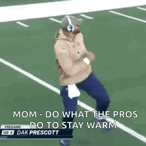 a man is running on a football field with the words `` mom do what the pros do to stay warm '' written on the screen .