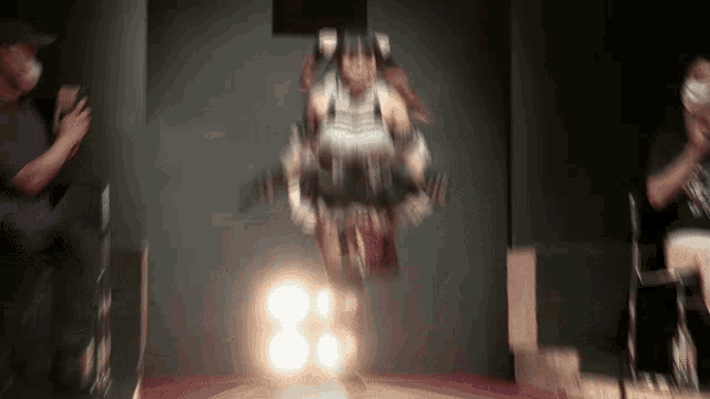 a blurred image of a person in a robot costume jumping in the air