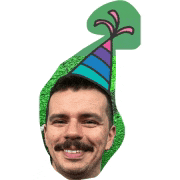 a man with a party hat on his head is smiling