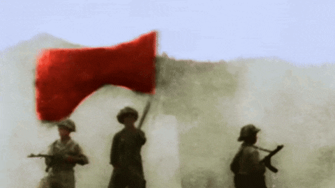 two soldiers holding guns and a red flag