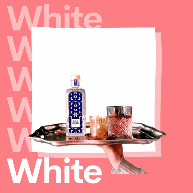 a person holding a tray with a bottle of spiced vodka