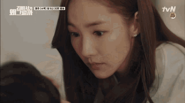 a woman is looking at herself in a tvn advertisement