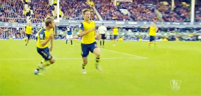 a soccer game is being played in a stadium sponsored by etihad airways