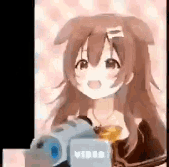 a girl with brown hair is holding a camera in her hand .