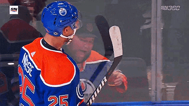 a hockey player wearing a number 25 jersey