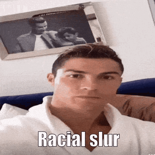a picture of a man with the words racial slur on it