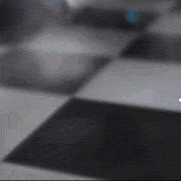 a black and white checkered floor with a arrow pointing to the right