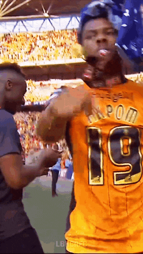 a man in a yellow jersey with the number 19