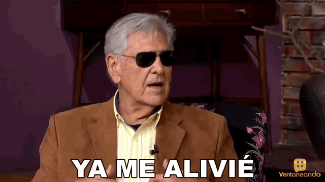 a man wearing sunglasses and a jacket says ya me alivie