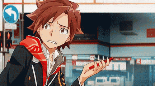 a boy with red hair is standing in front of a sign that says left turn