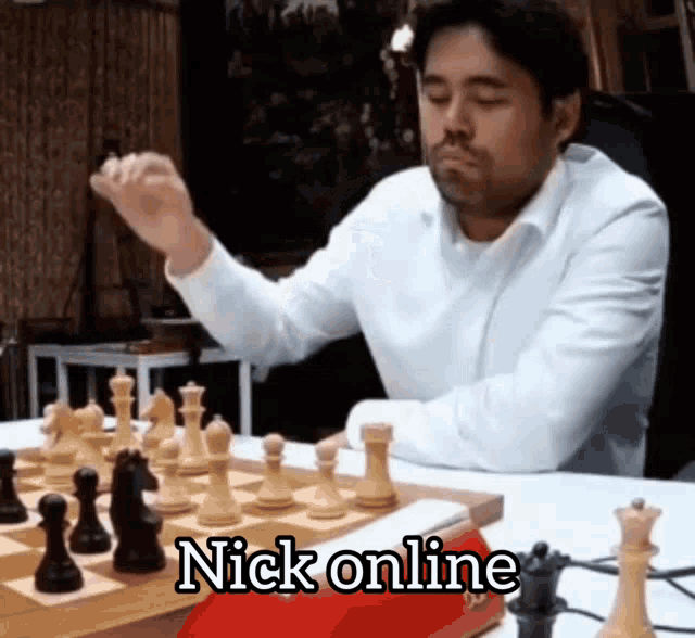 a man in a white shirt is playing chess with the words nick online written on the bottom