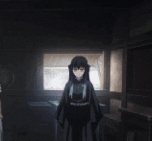 a girl in a black kimono is standing in a dark room .