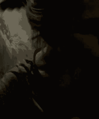 a woman is taking a selfie in a dark room