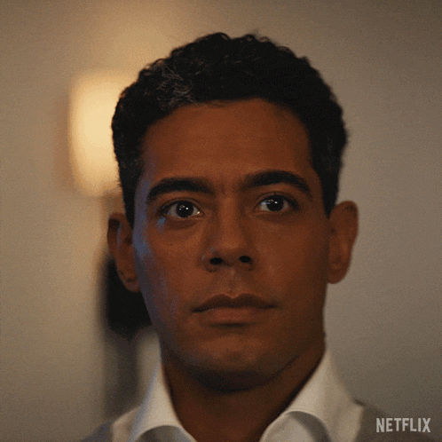 a close up of a man 's face with the word netflix on the bottom right