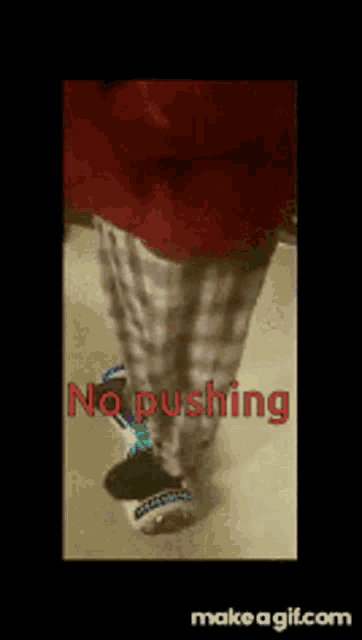 a person wearing plaid pants and slippers says no pushing on the screen