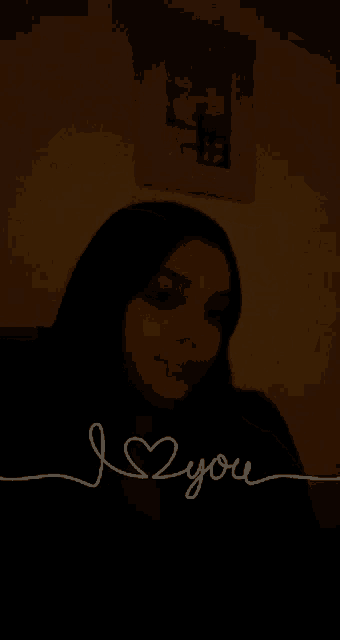 a woman in a dark room with the words i love you written on the bottom