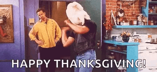 a man with a turkey on his head is dancing in a kitchen with two men .