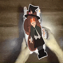 a person is holding a sticker of a girl in a witch outfit