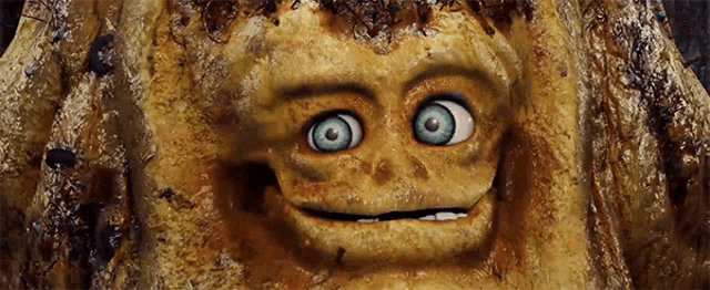 a close up of a cartoon character 's face with a blue eye