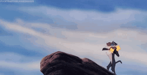 a cartoon character is standing on top of a rock .