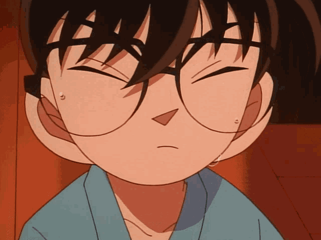 a close up of a person 's face with glasses
