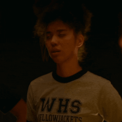 a woman wearing a whs yellowjackets shirt