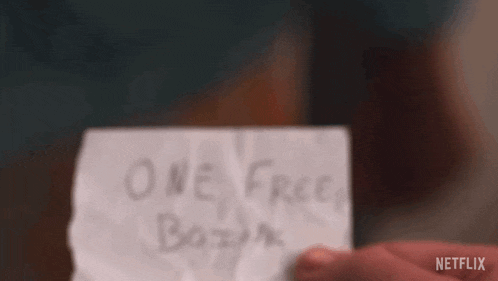 a person is holding a piece of paper that says " one free boink "