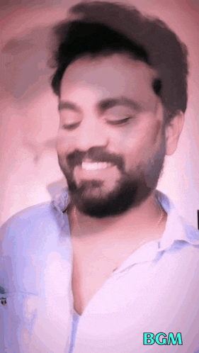 a man with a beard is smiling with the word bgm on the bottom right