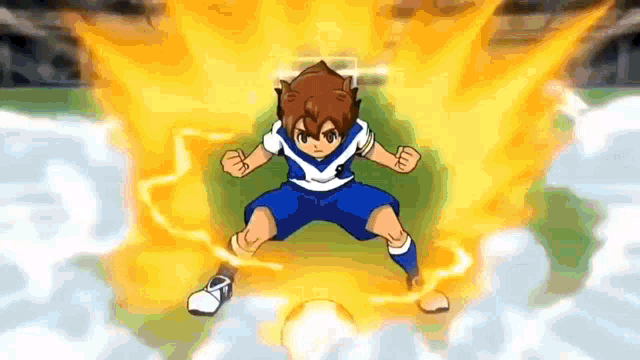 a boy in a blue and white uniform is standing in front of a fireball