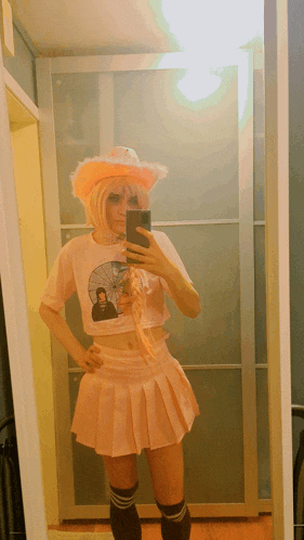 a person taking a picture of themselves in front of a mirror