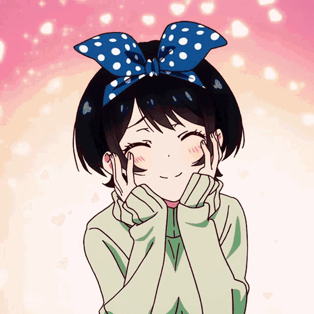 a girl with a blue polka dot bow on her head is smiling