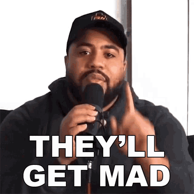 a man speaking into a microphone with the words they 'll get mad