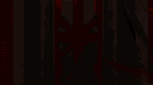 a video game character is holding a gun in a hallway