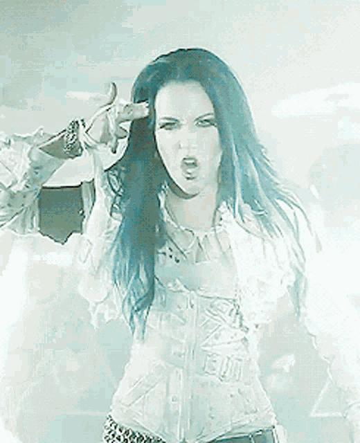 a woman with long dark hair is wearing a white jacket