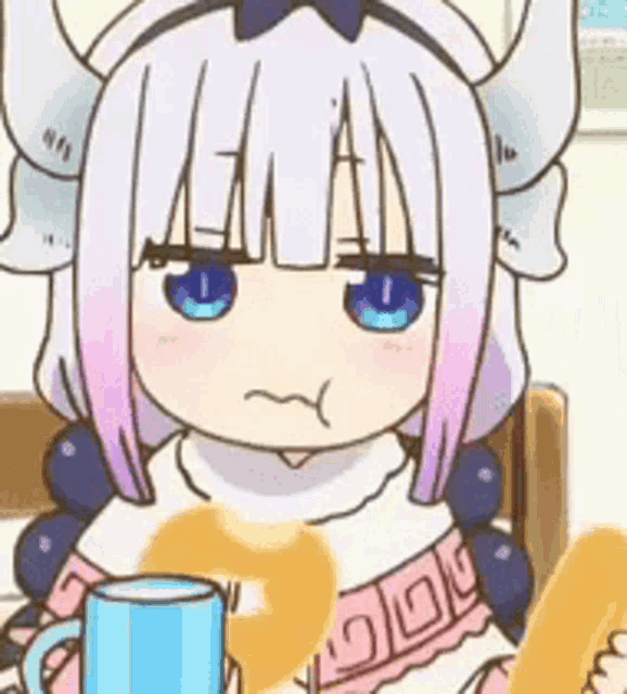 a cartoon girl with horns is sitting at a table holding a cup and a donut .