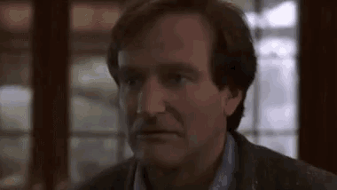 a close up of a man 's face looking at the camera .