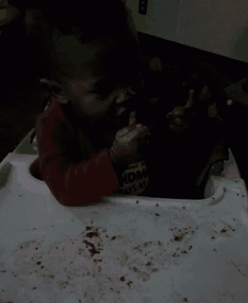 a baby in a high chair with a shirt on that says ndm