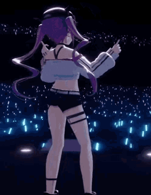 a 3d anime girl is dancing on a stage in front of a crowd of people .