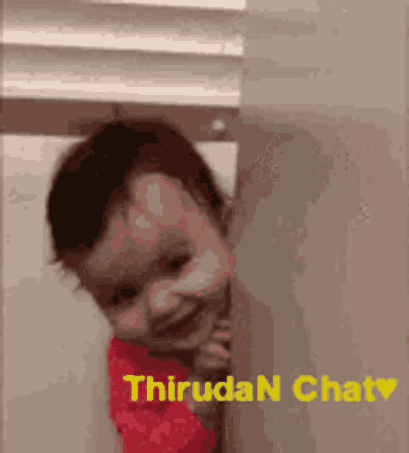 a baby peeking out from behind a wall with the words thiruda n chat written on it